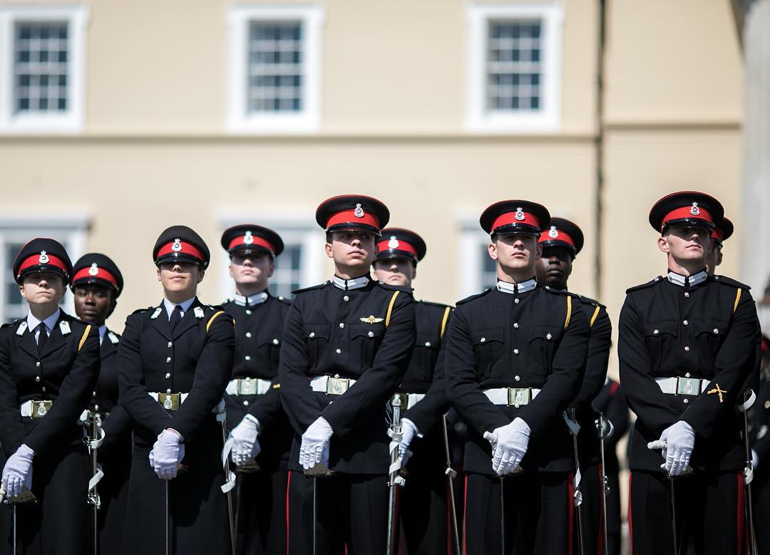 Crown Prince Hussein bin Abdullah (center) stands at ease during the Commissioning Parade at the Royal Military Academy Sandhurst, Aug. 11, 2017.