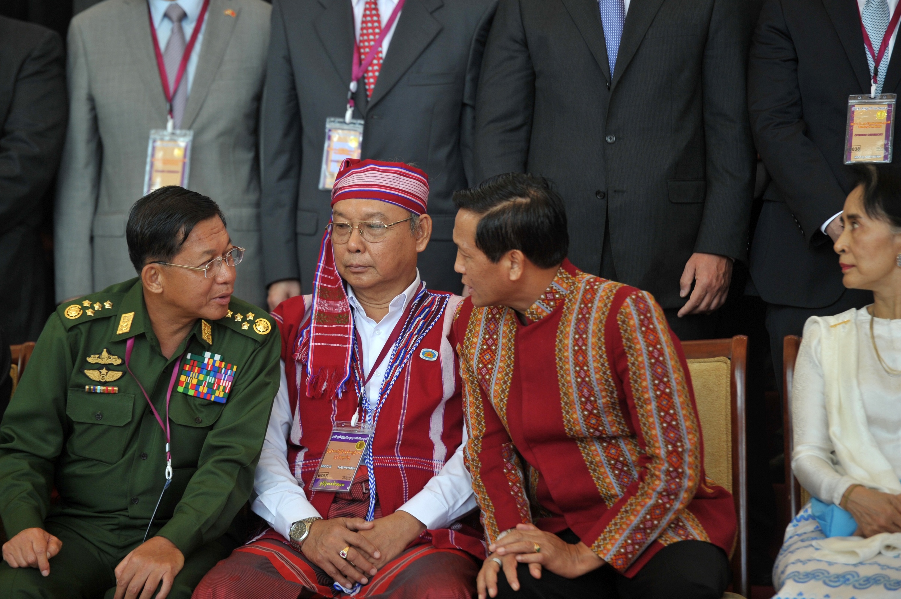 Myanmar's military, which is staging the crackdown on the Rohingya, has massive power in the country. In this photo taken Aug. 31, 2016, Myanmar military commander Senior Gen. Min Aung Hlaing, left, speaks with Vice President Henry Van Thio as de facto leader Aung San Suu Kyi looks on.