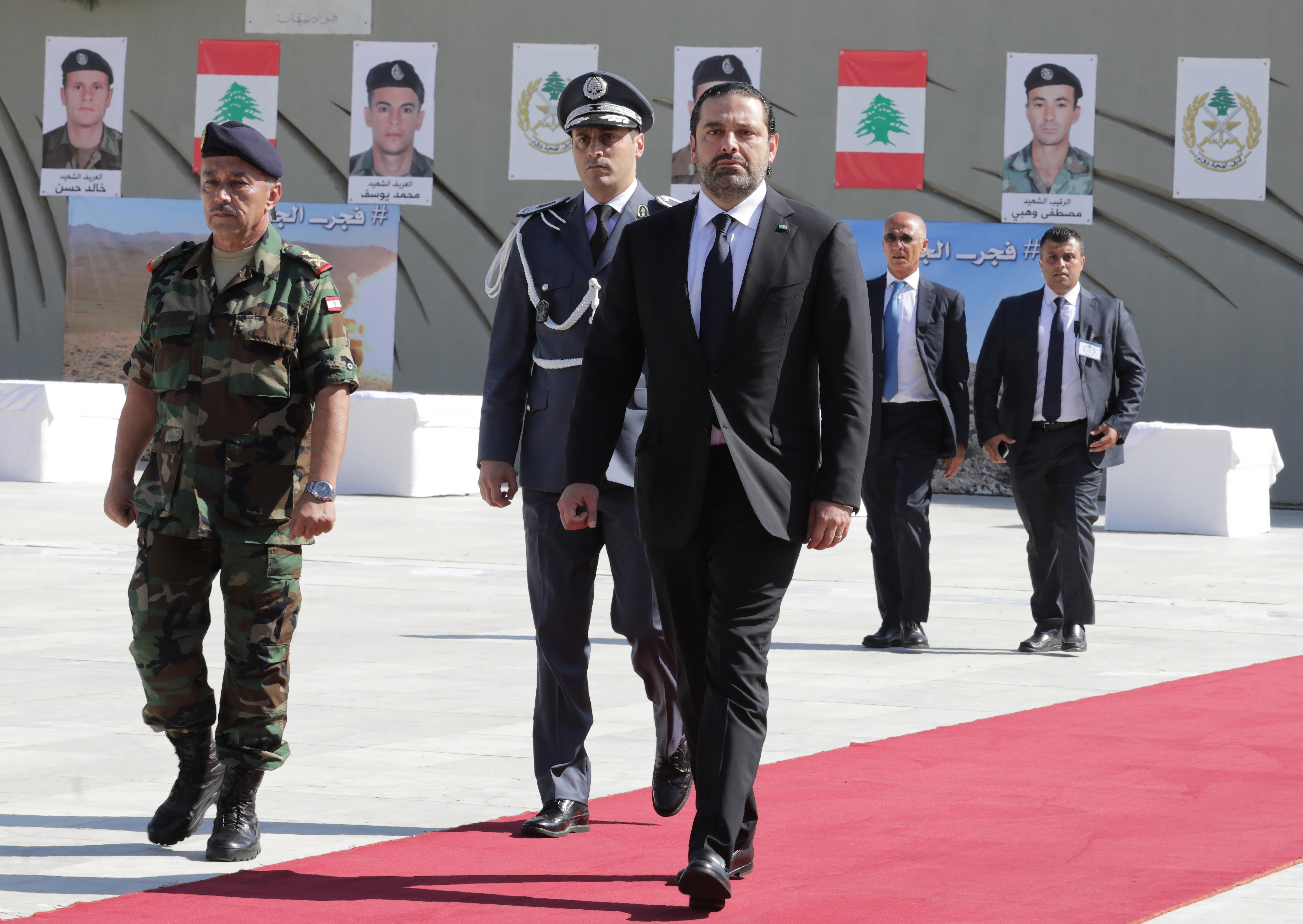 Lebanese Prime Minister Saad al-Hariri (center) attends a Sept. 8 funerary procession for 10 Lebanese army soldiers killed by the Islamic State.