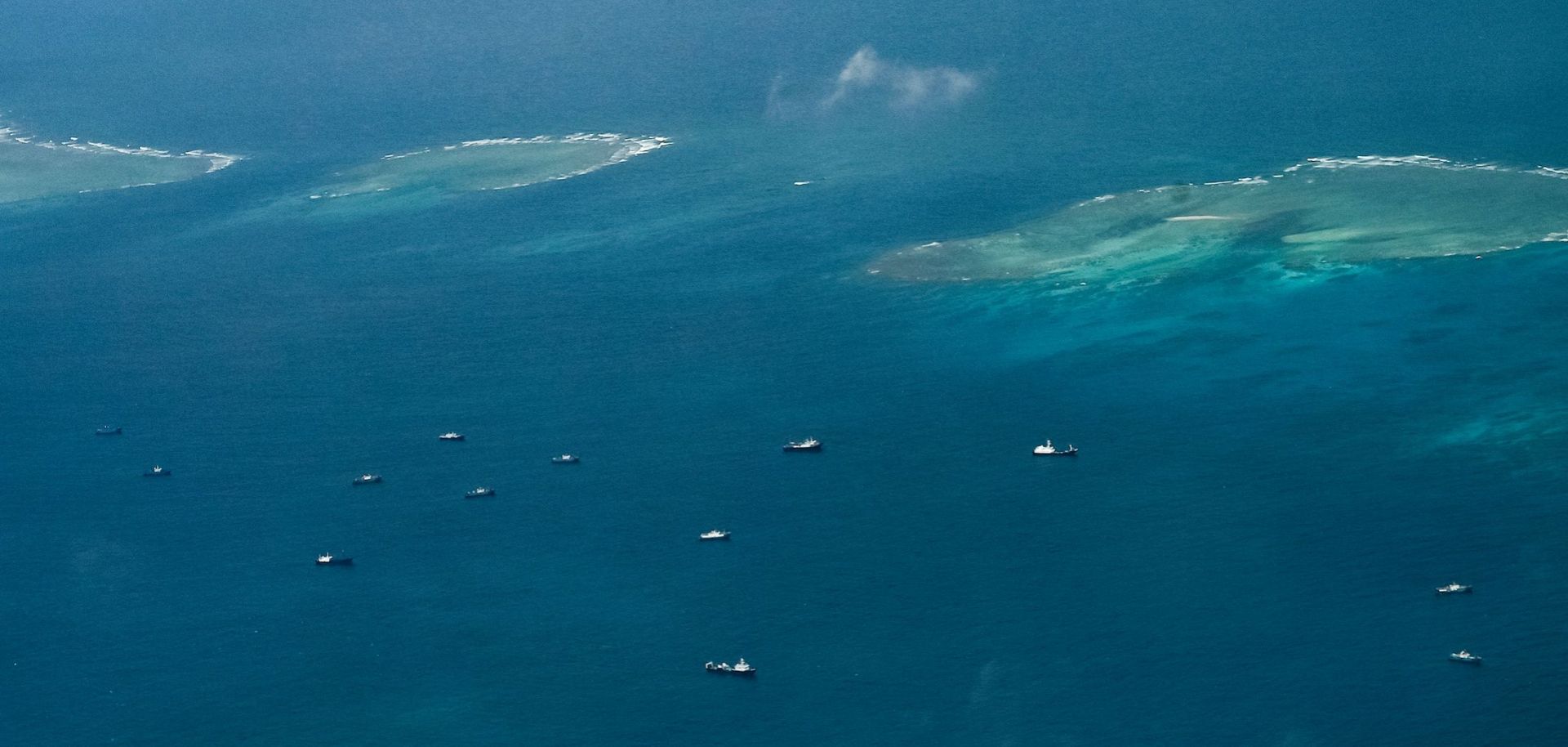 Chinese maritime militia vessels float near the Philippine-controlled island of Thitu, which Filipinos call Pag-asa, in the contested Spratly Islands in the South China Sea on March 9, 2023.