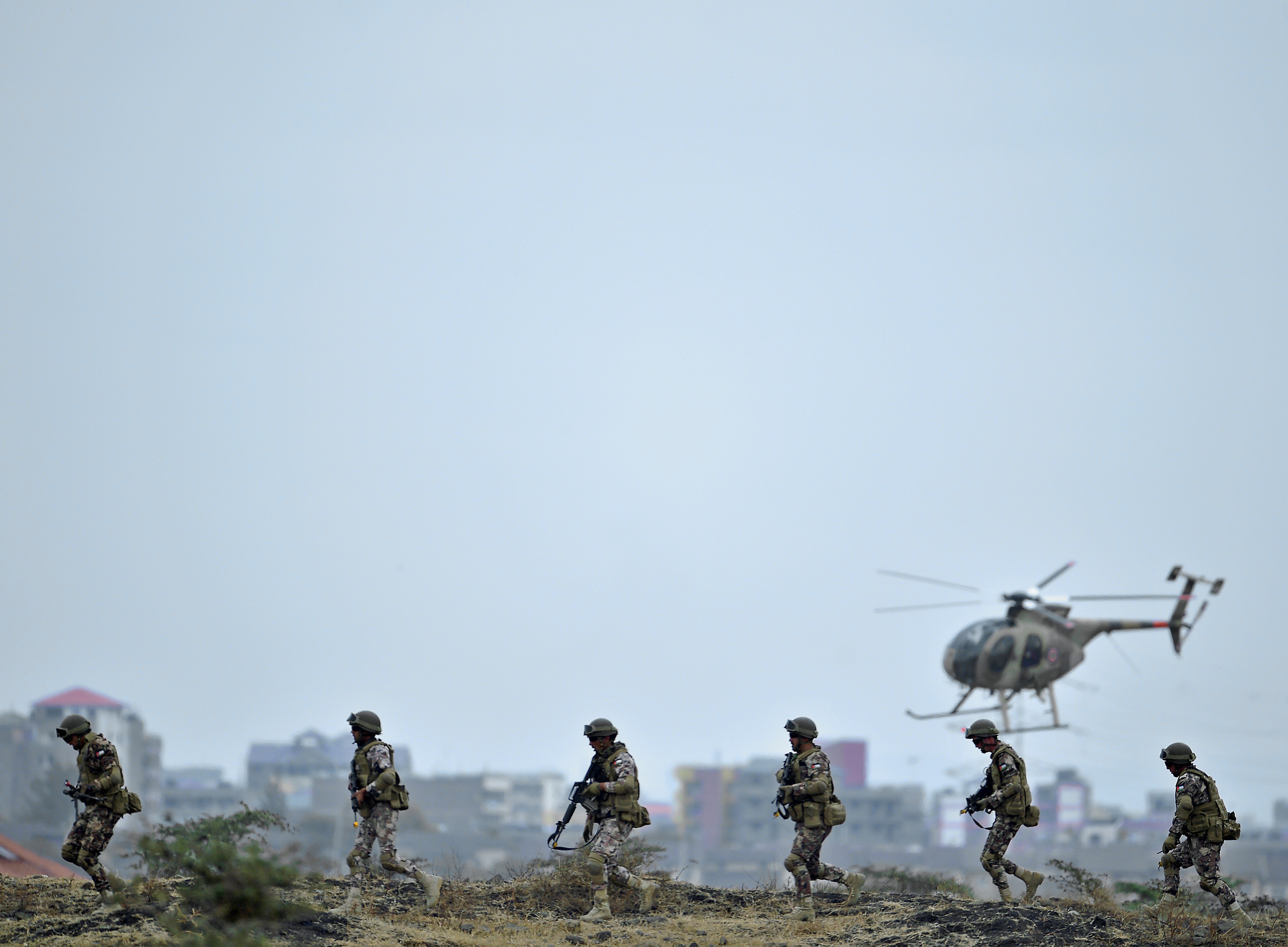Elements of the Kenya Defense Forces and Royal Jordanian Armed Forces participate in a combat simulation in Nairobi in 2016. 