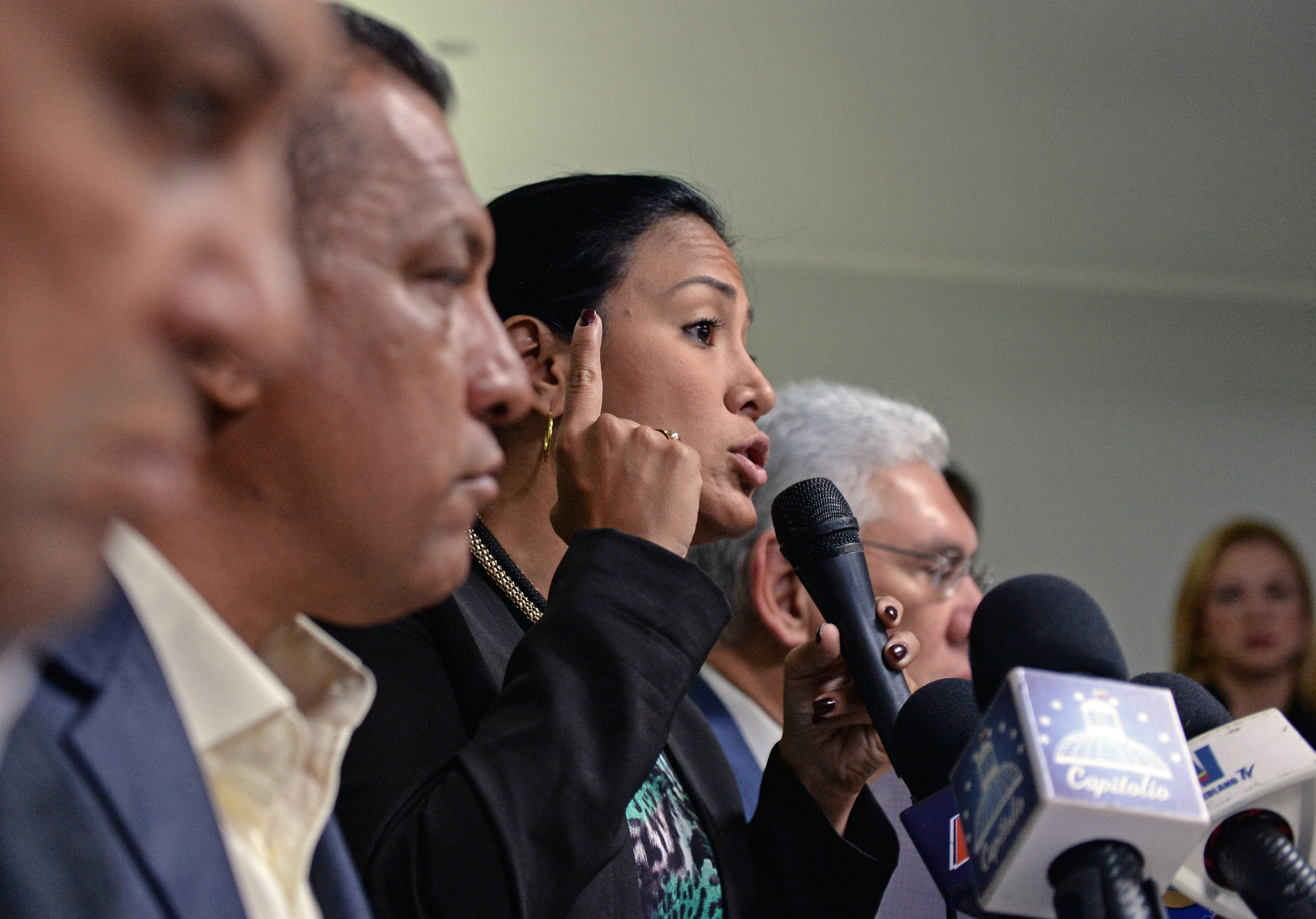 Laidy Gomez, center, a member of Venezuela's political opposition and the newly elected governor of Tachira state, speaks at a press conference on Oct. 24. 