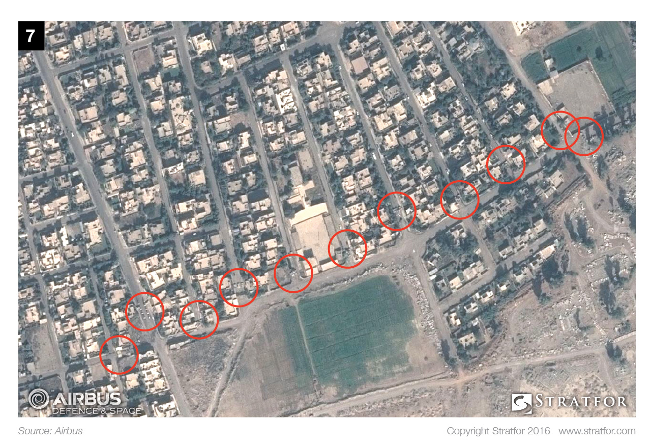 The Islamic State has placed concrete blocks -- perhaps portions of concrete walls -- and other rubble in the streets to prevent vehicles from navigating them.