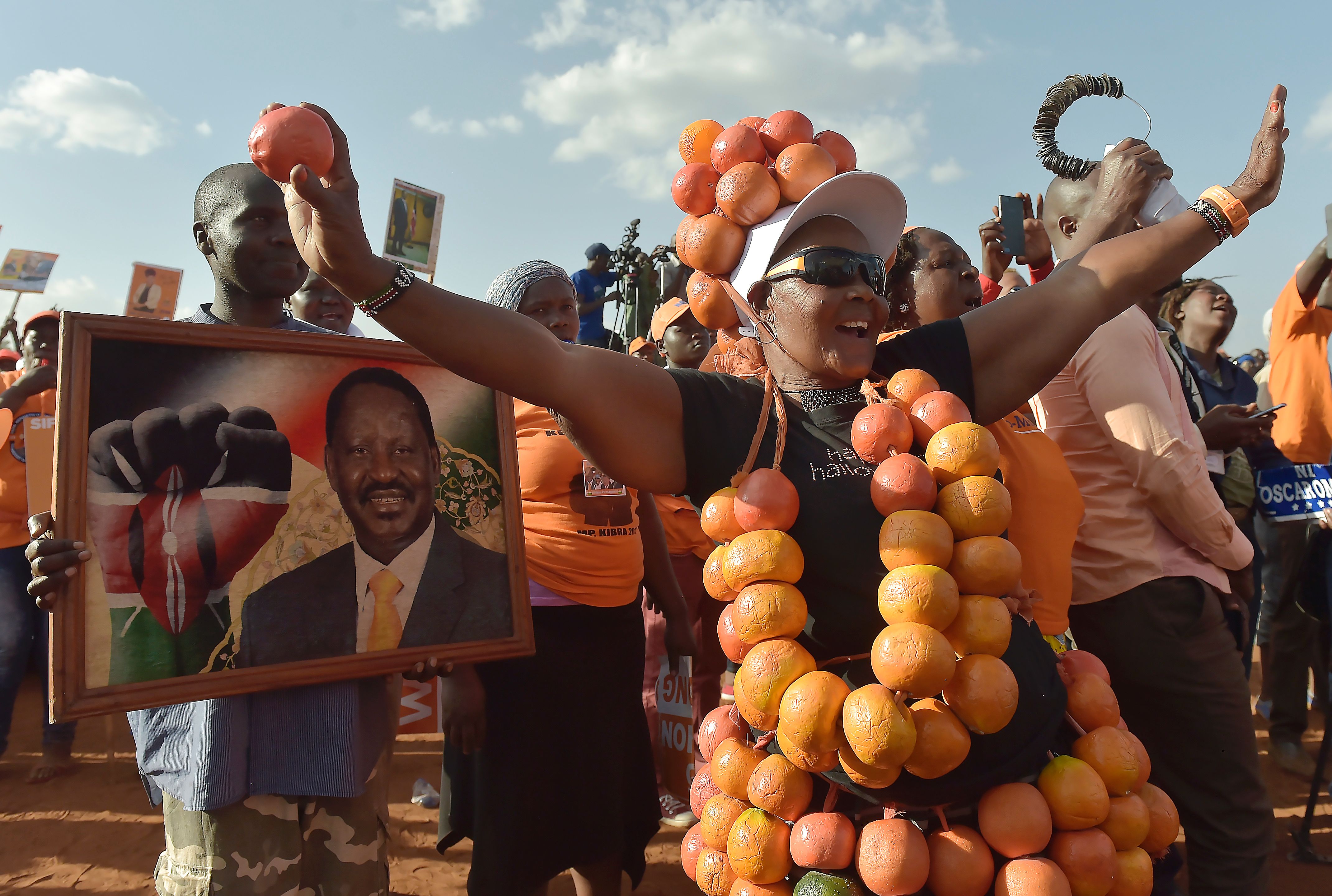 Supporters of the National Super Alliance party listen to oppostion leader and presidential candidate Raila Odinga during a campaign rally in Nairobi, July 18. 