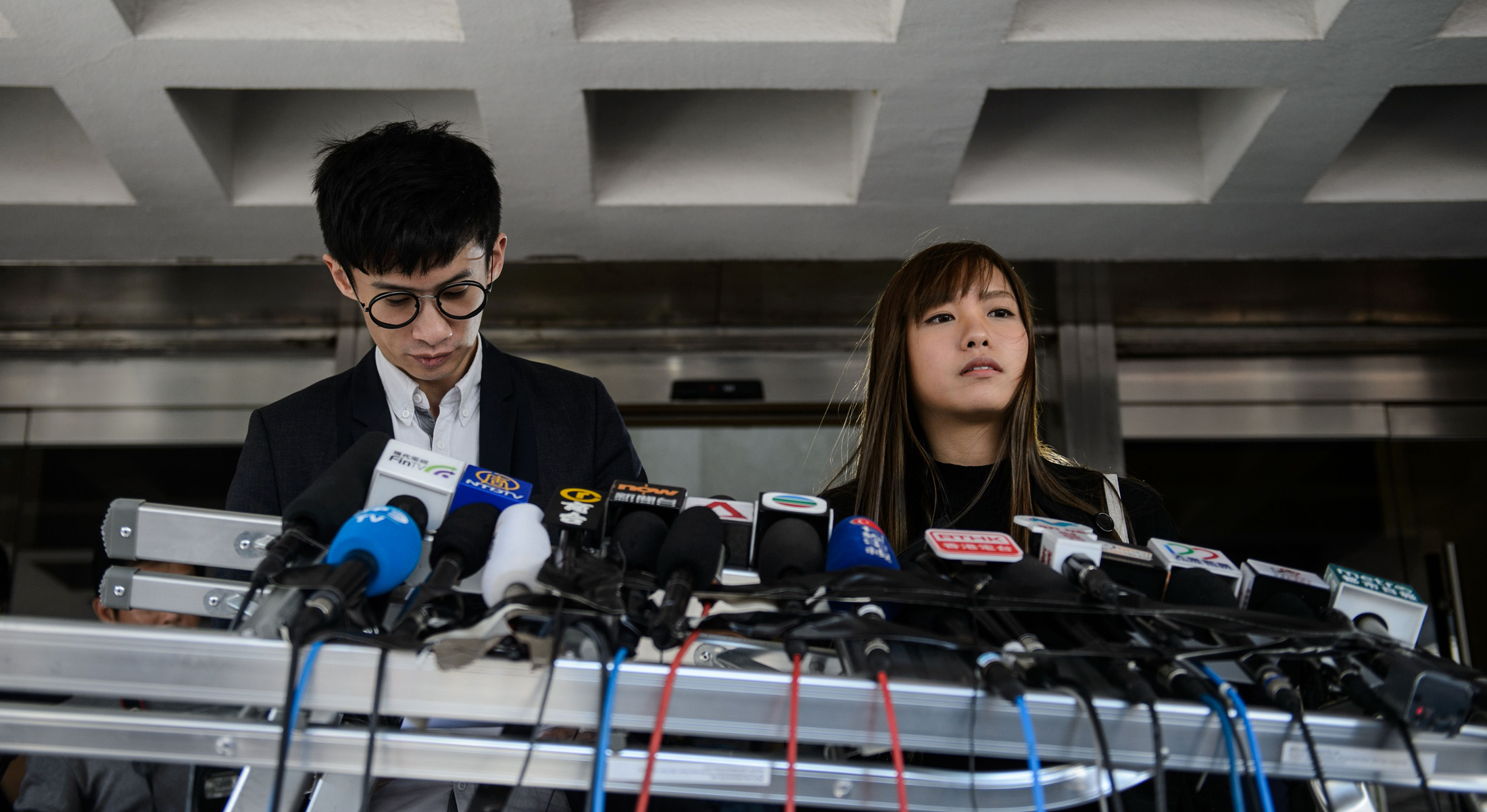 Baggio Leung (l) and Yau Wai-ching, both pro-indpendence lawmakers, were among six representatives barred from taking their seats in Hong Kong's legislature. 