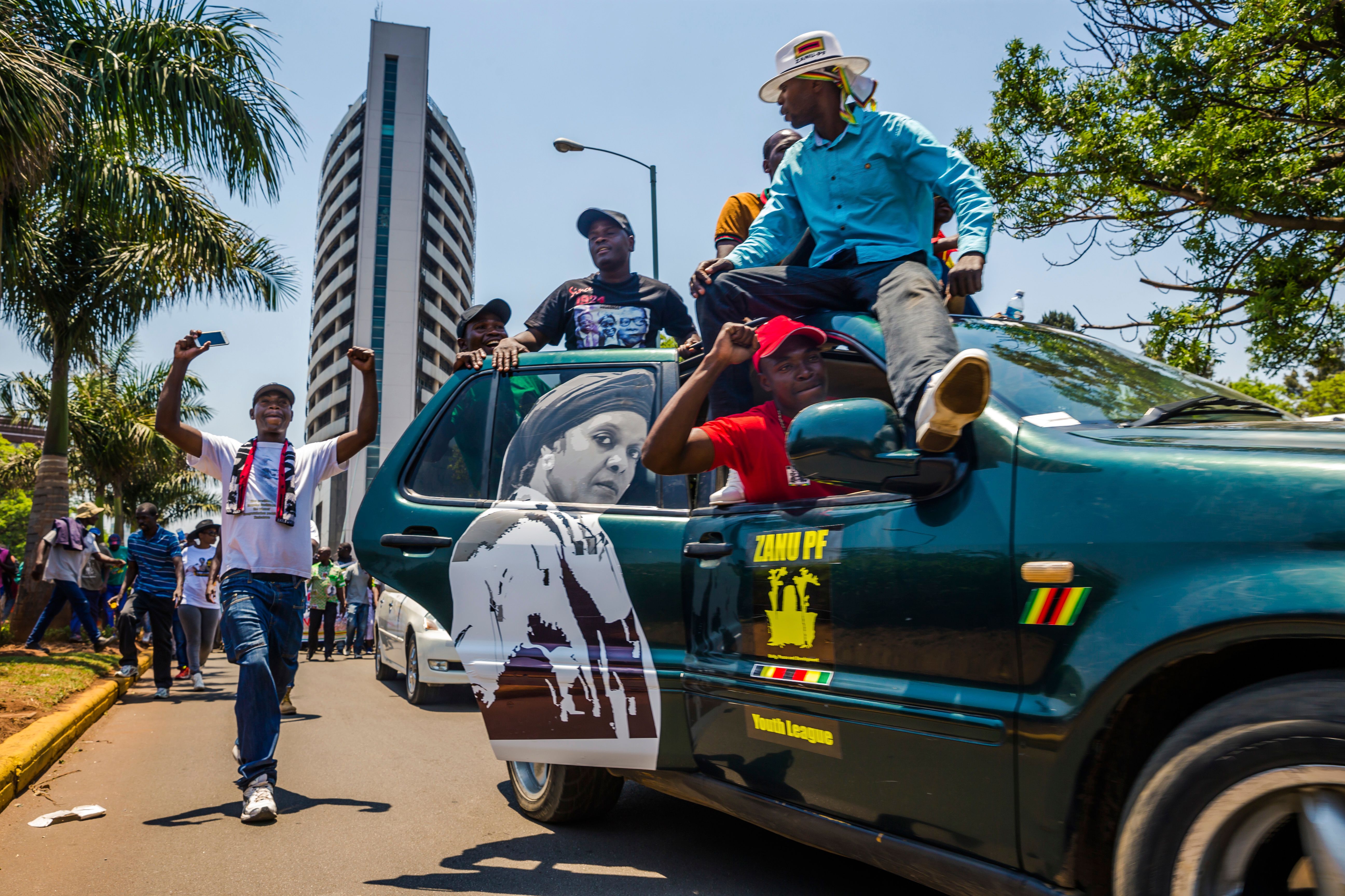Supporters of Zimbabwean President Robert Mugabe gather at his party headquarters to express their support for the appointment of his wife, Grace Mugabe, to the role of vice president and likely successor after the firing of Emmerson Mnangagwa. 