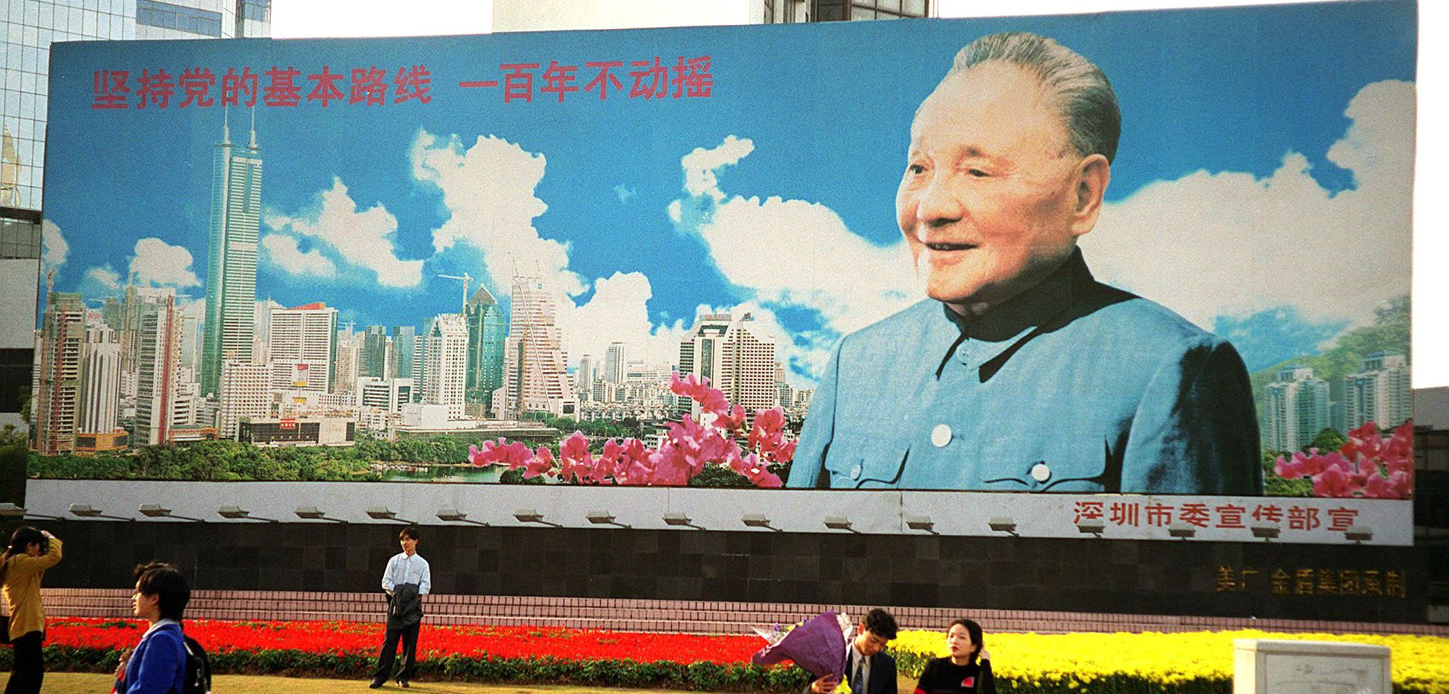 A billboard in Shenzhen depicts the late leader Deng Xiaoping, the architect of China's long-standing noninterventionist strategy.