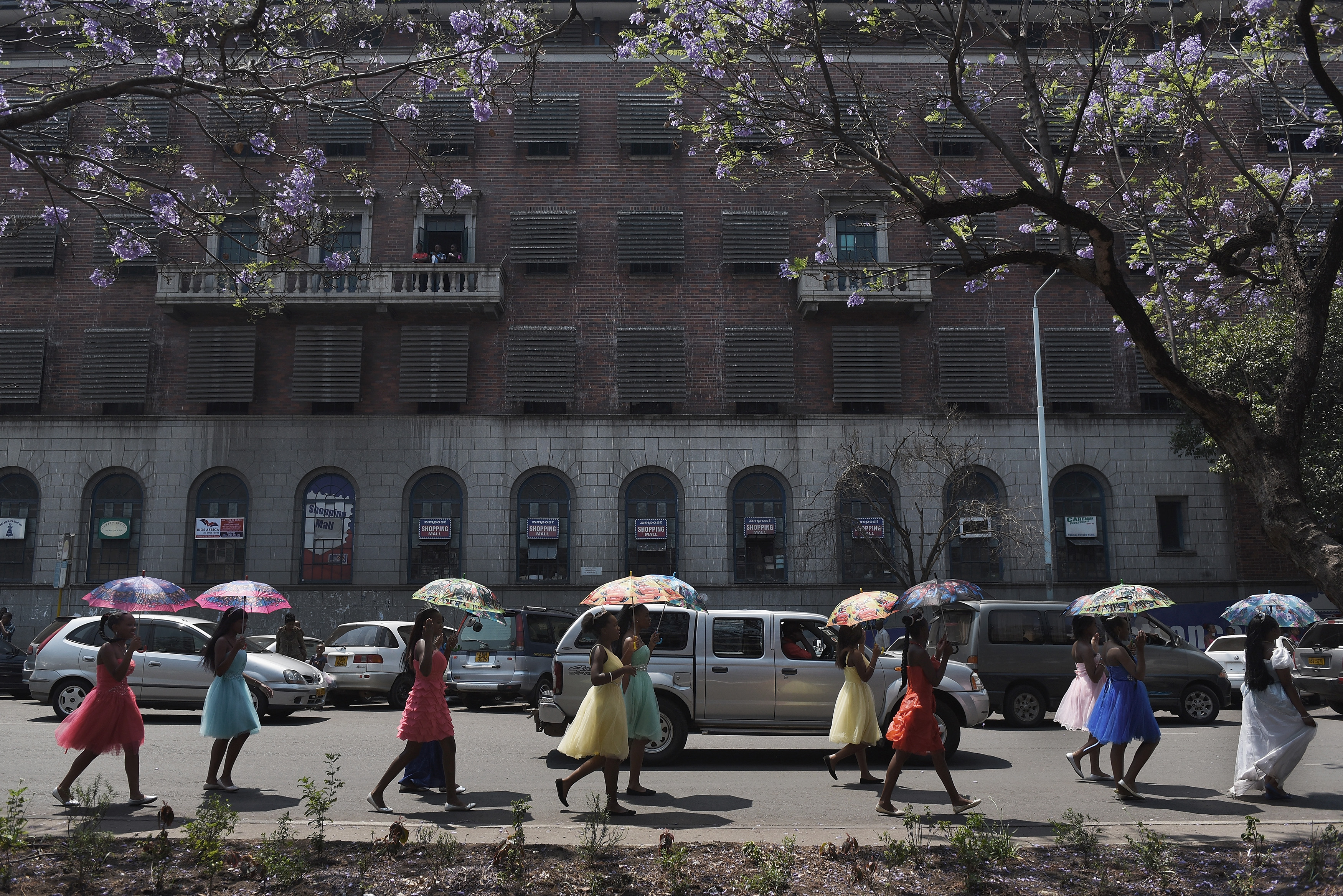 Schoolchildren take part in a carnival in the streets of Zimbabwe's capital, Harare, in 2015. 