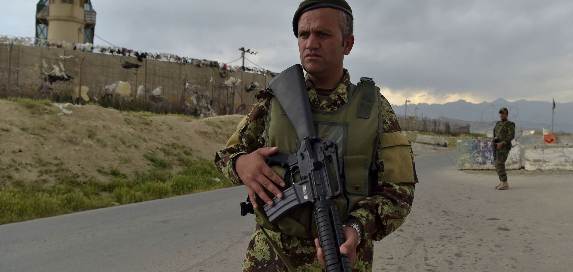 An Afghan soldier stands guard at a checkpoint outside a U.S. military base in Bagram, located roughly 50 kilometers north of Kabul, on April 29, 2021.