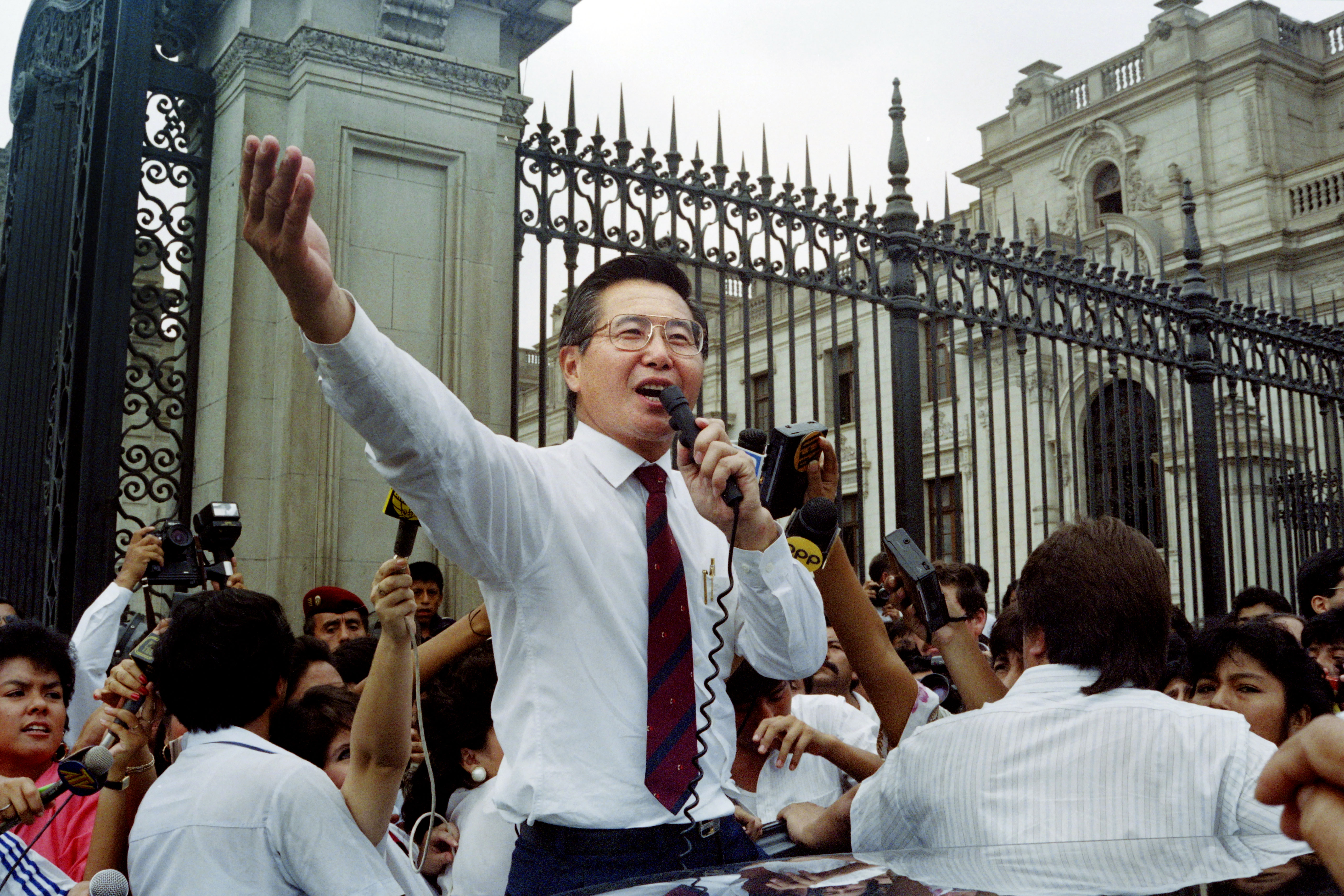 Peruvian President Alberto Fujimori addresses a crowd outside the government palace in Lima during a surprise public appearance in April, 1992. 