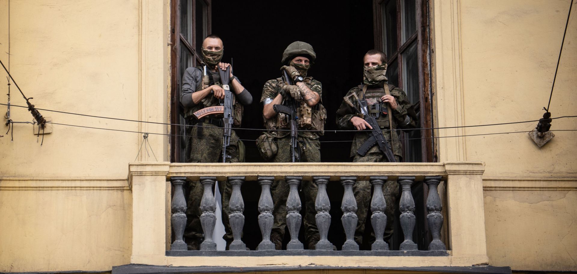Wagner mercenaries stand on the balcony of a building in the Russian city of Rostov-on-Don on June 24, 2023.