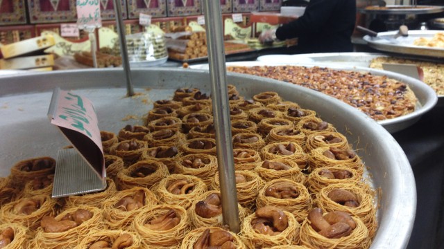 A sweet shop run by a Syrian refugee family in downtown Amman selling iconic pastries from Homs. 