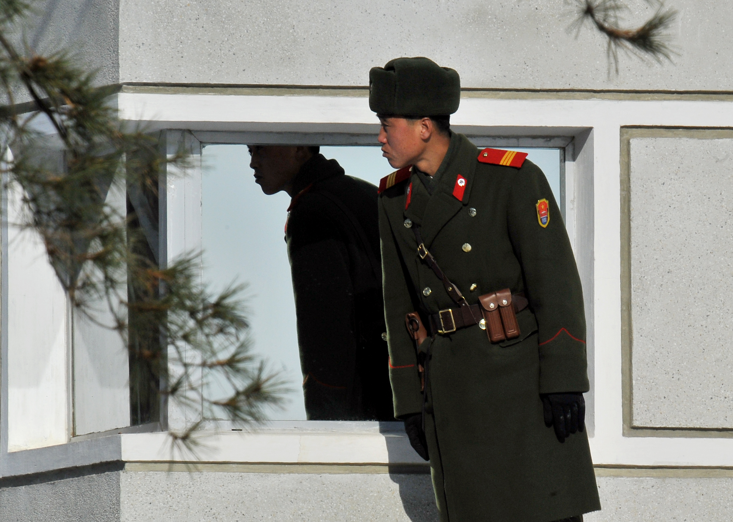 A North Korean soldier stands at a guard station in the Demilitarized Zone in early 2011.