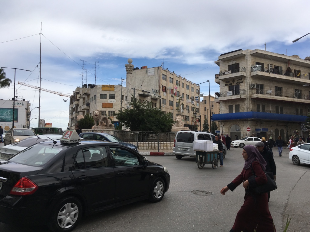 A Palestinian woman on a street in central Ramallah.