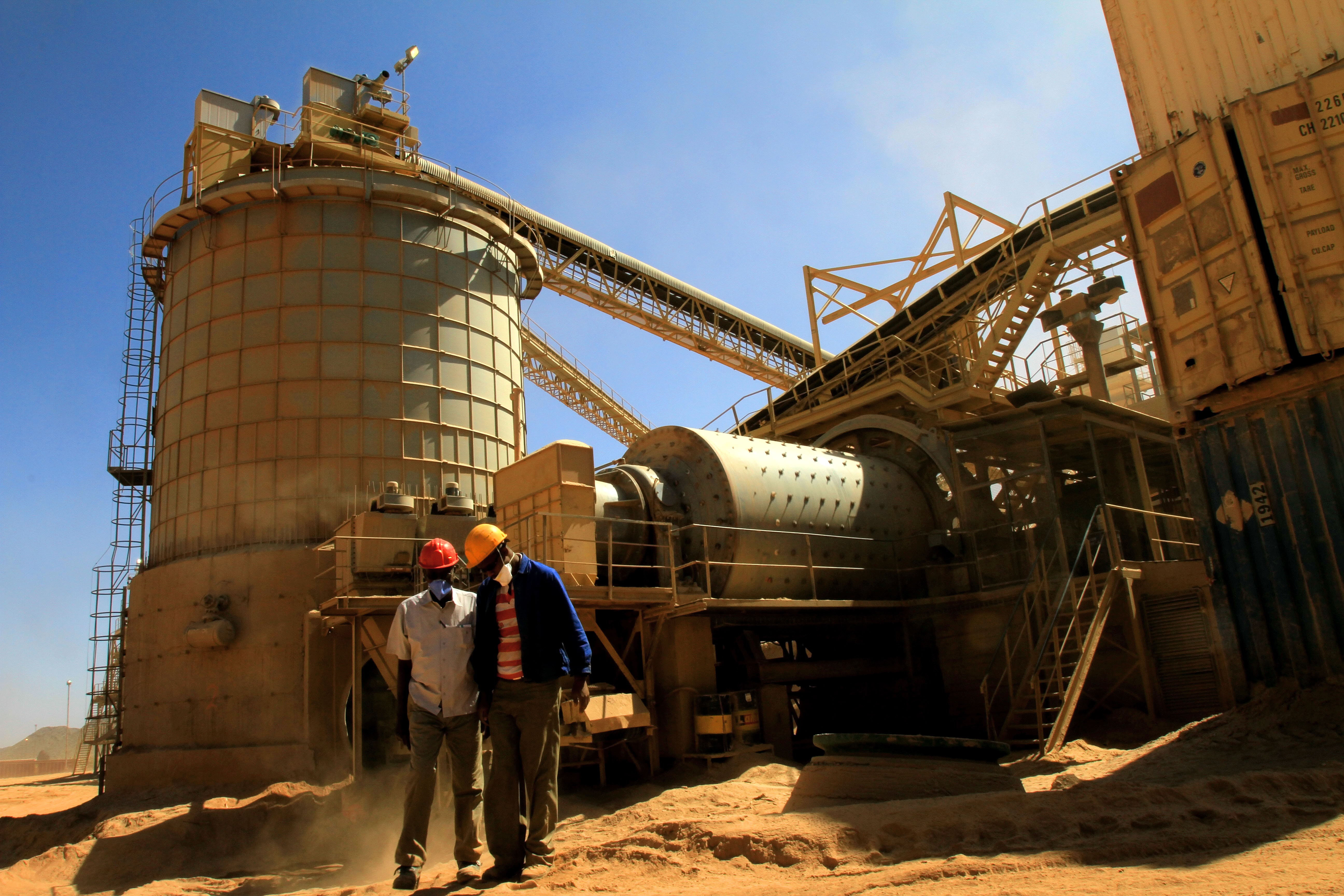 Workers stand at an Ariab gold mine in the Sudanese desert, located 800 kilometers (roughly 497 miles) northeast of Khartoum. 