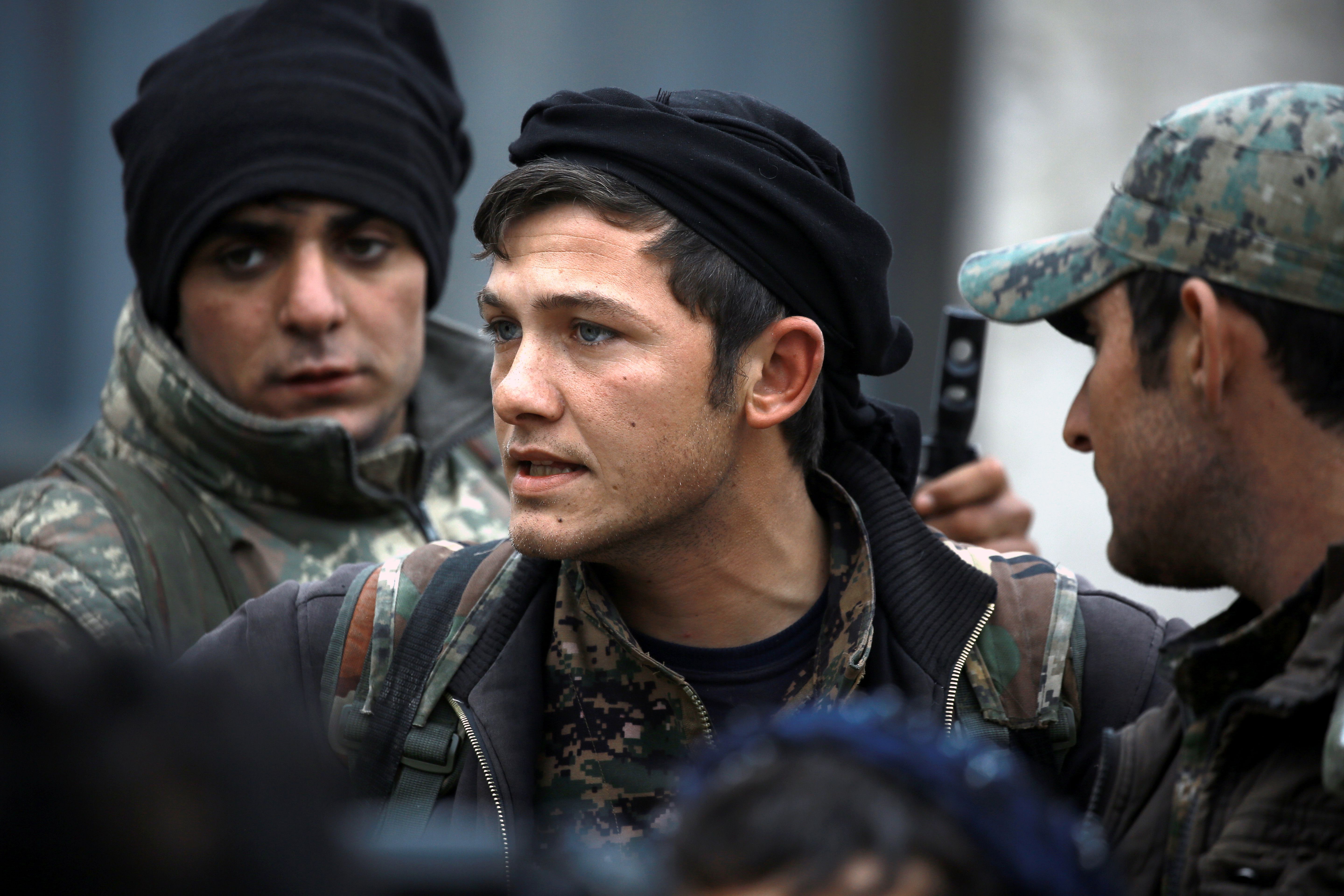 SDF members in Manbij in March of last year. 