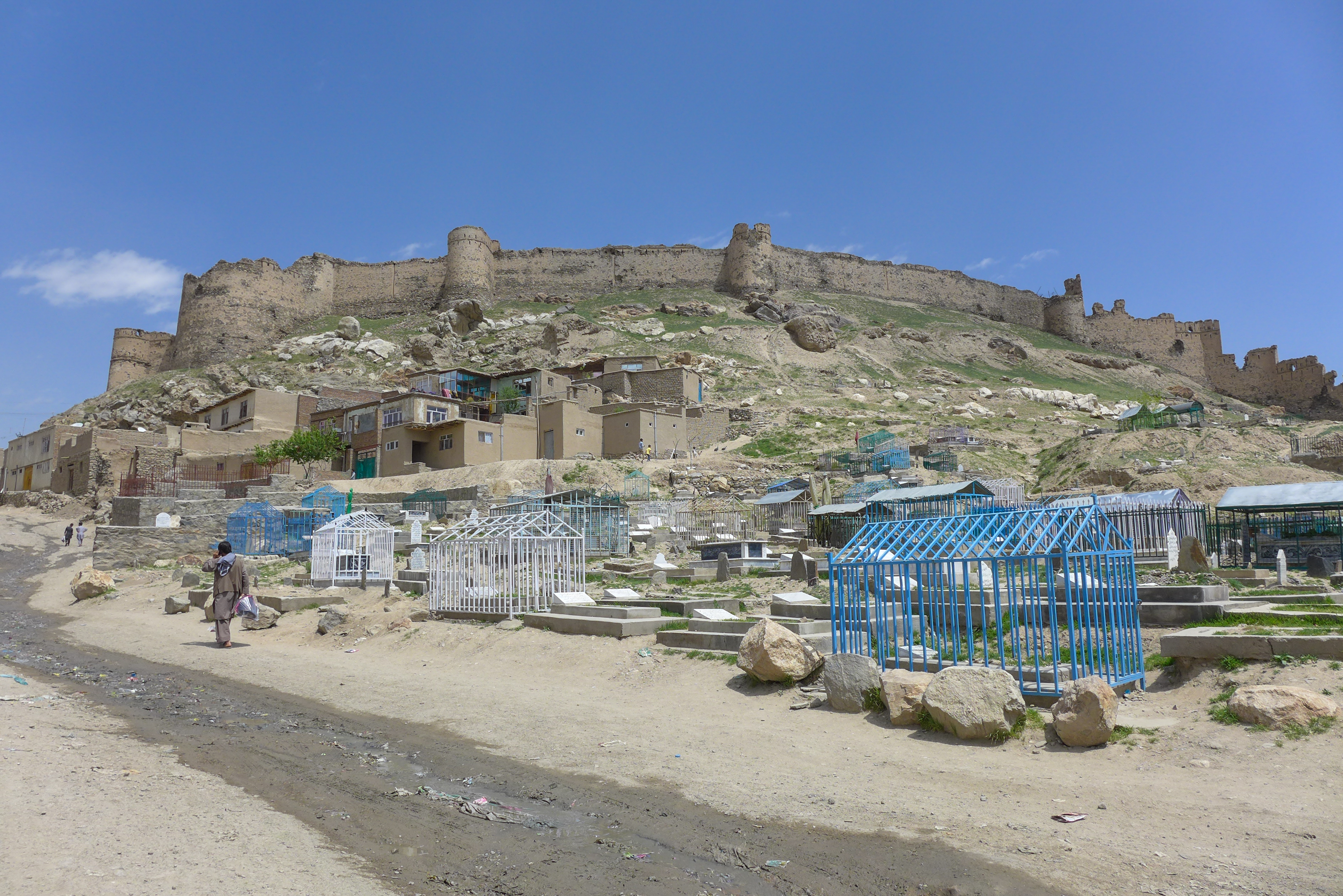 The legacy of a bygone era, a British fort overlooks a rural Afghan settlement.