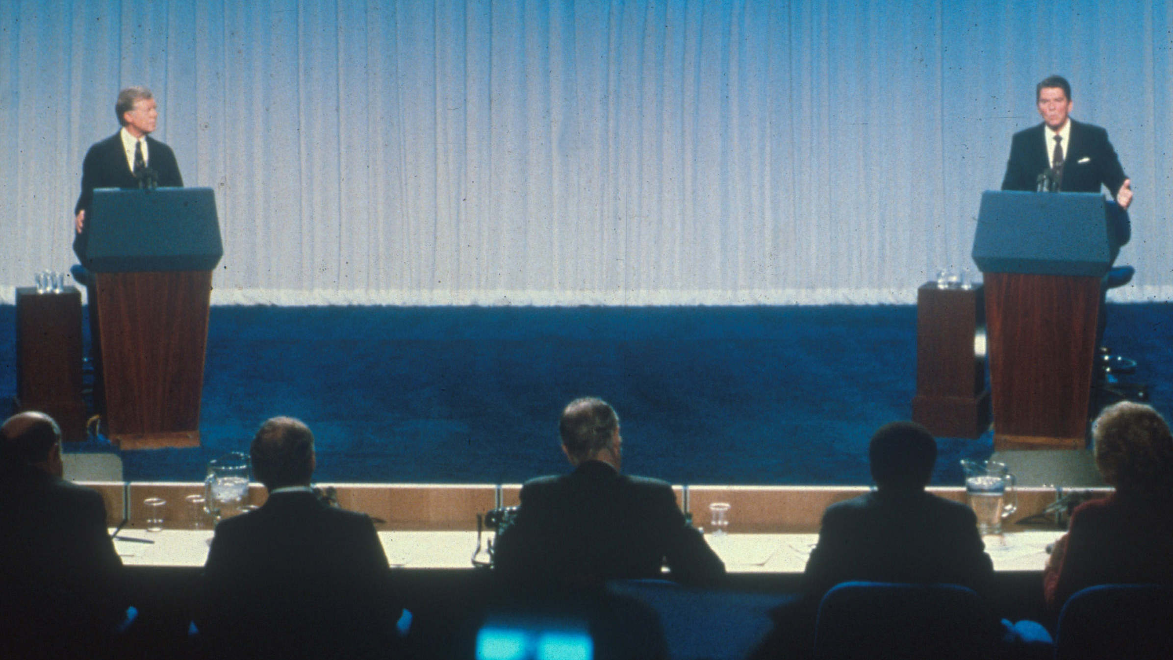 U.S. President Jimmy Carter and challenger Ronald Reagan debate during the 1980 presidential election campaign.