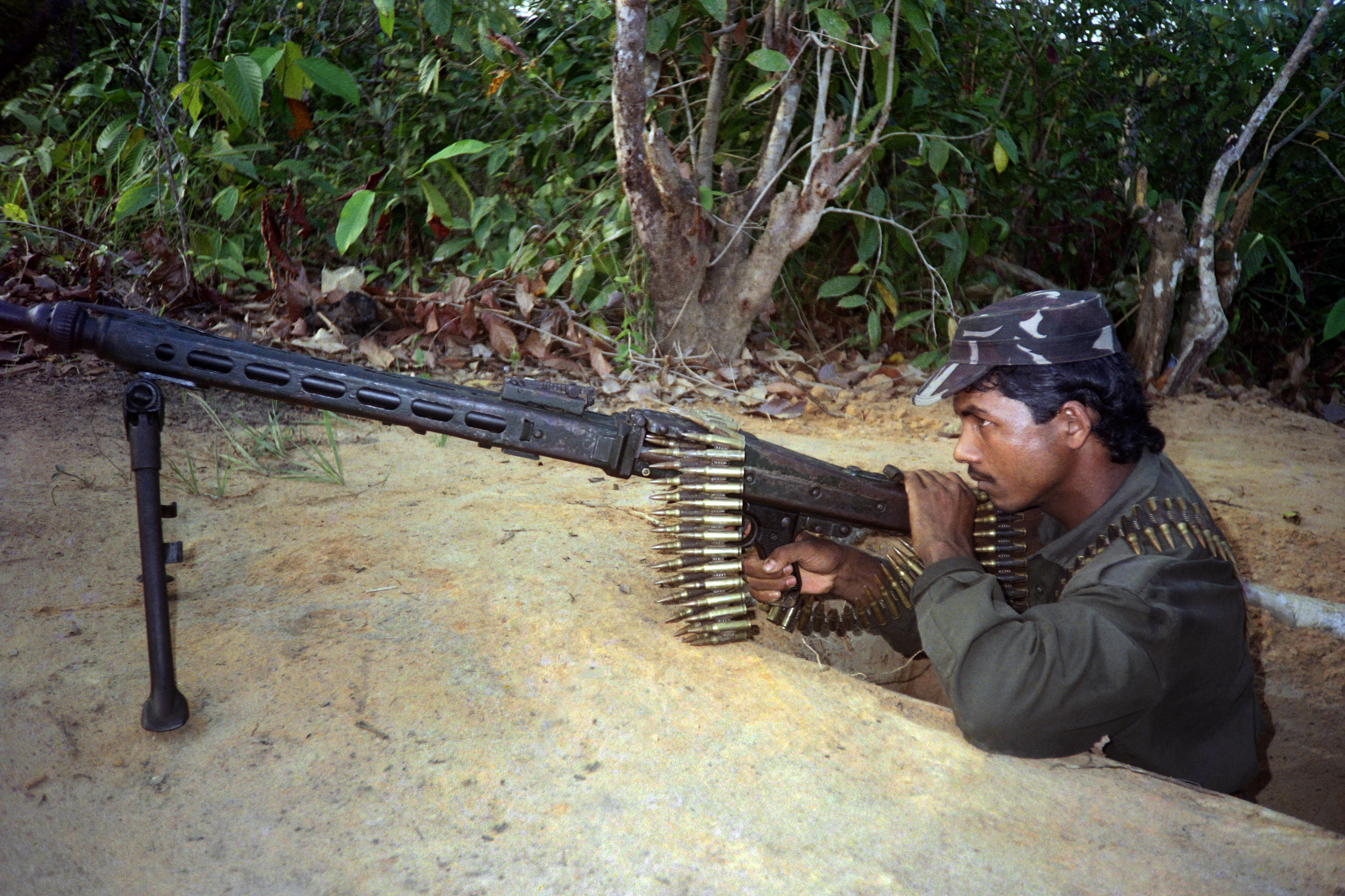 An insurgency group calling itself the Arakan Rohingya Salvation Army attacked police and military outposts on Aug. 25, prompting Myanmar's military to crack down on the Rohingya in response. In 1992, the growth of another group, the Rohingya Solidarity Organization, sparked a crisis with Bangladesh. In this March 1992 photo, a Rohingya fighter guards an outpost on the border.
