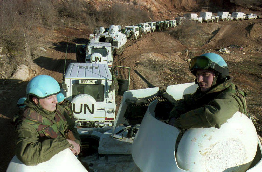 Dutch soldiers in an armored personnel carrier accompany a United Nations convoy of 56 on its way to Lukavac, Feb. 28, 1994.