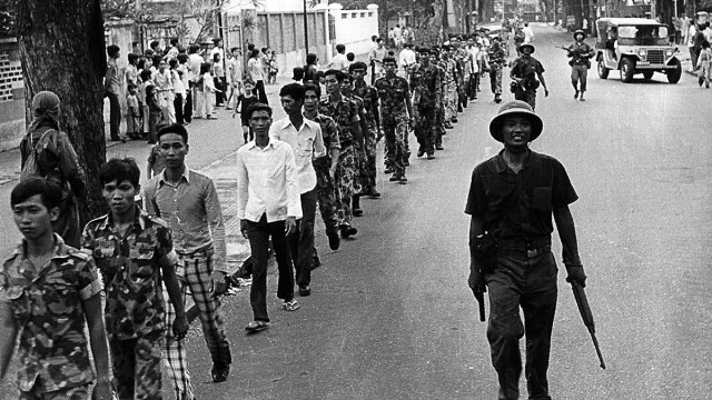 A line of captured South Vietnamese soldiers walk through the streets of Saigon on April 30, 1975, escorted by communist troops. The Vietnam War is popularly remembered as a U.S. defeat at the hands of an enemy a fraction of its size but, from a broader geopolitical perspective, it is hard to say what the United States really lost.