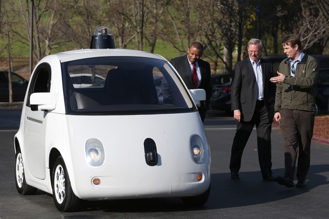 Google's Chris Urmson (R) shows a Google self-driving car to U.S. Transportation Secretary Anthony Foxx (L) and Google Chairman Eric Schmidt (C) at Google headquarters in February in Mountain View, California. 