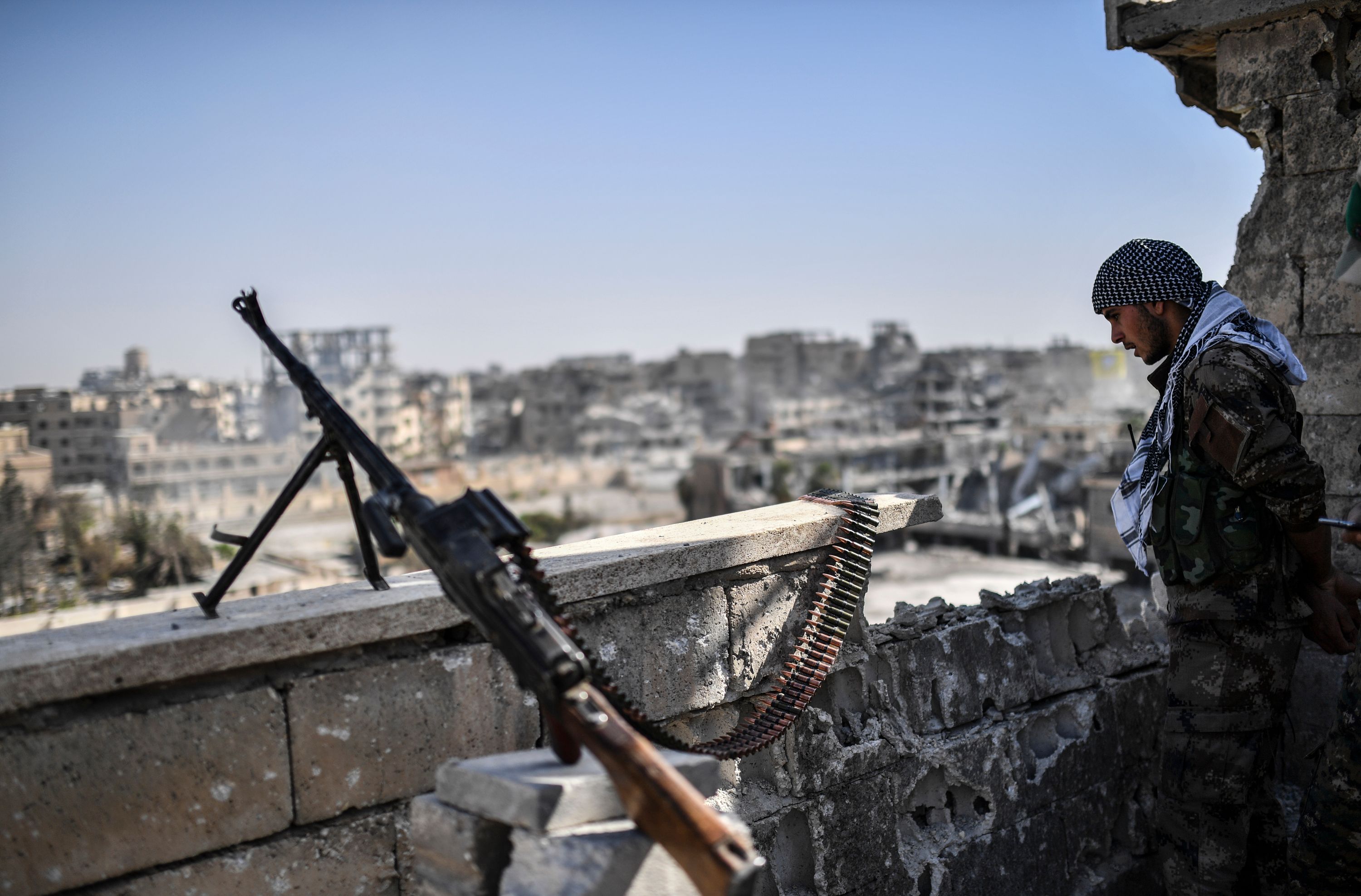 An SDF member stands guard in Raqqa.