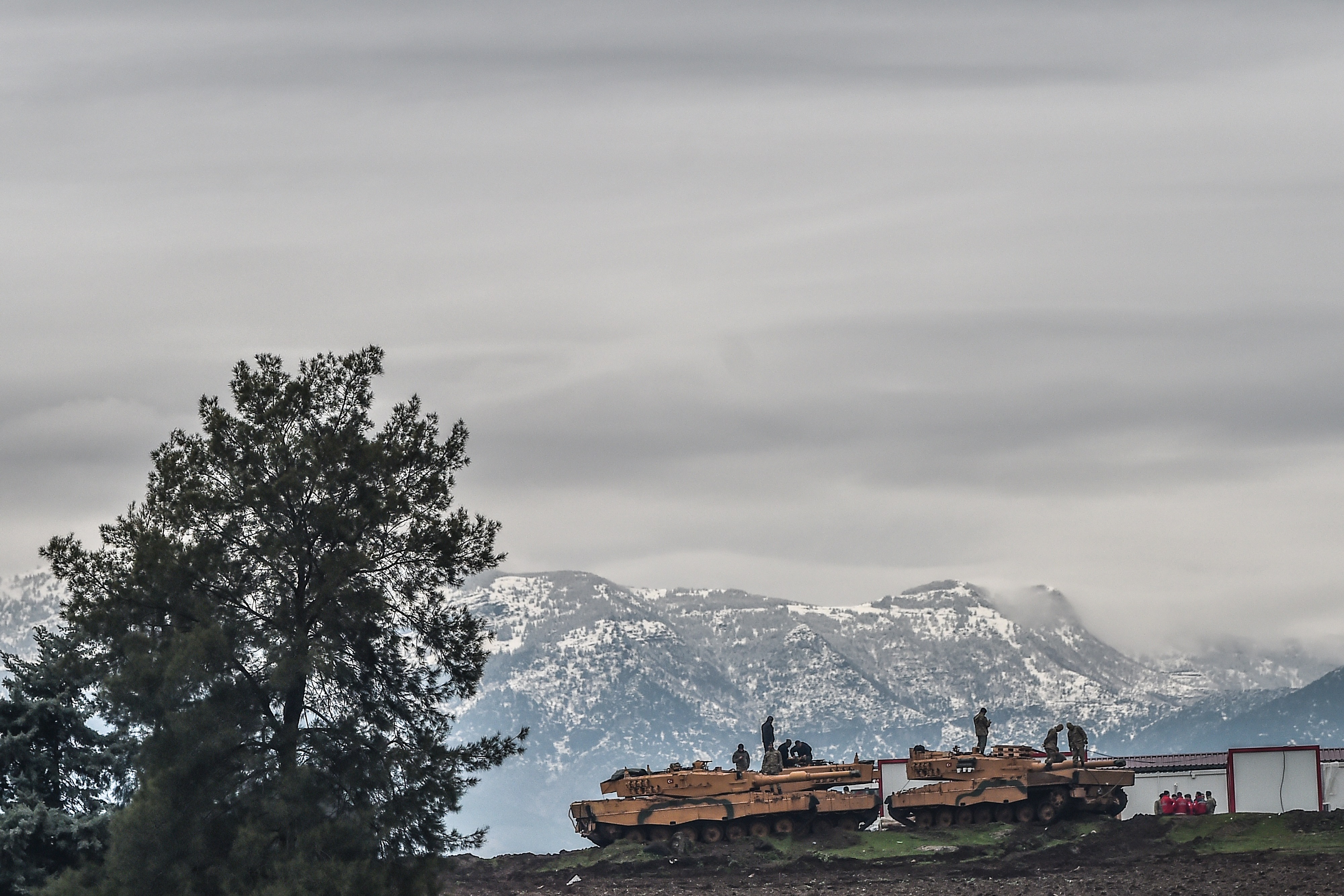 Turkish tanks sit near the Syrian border on Jan. 24.