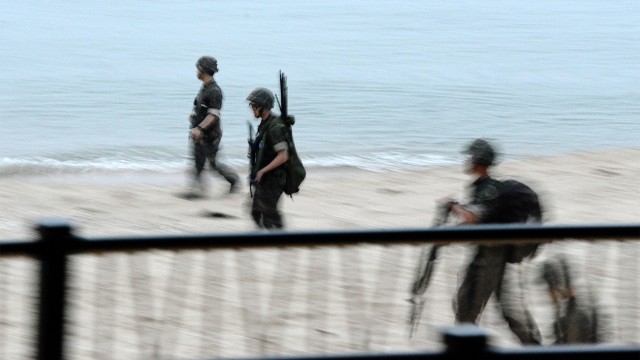South Korean soldiers patrol the beaches of Jeongdongjin, looking for suspicious activity.