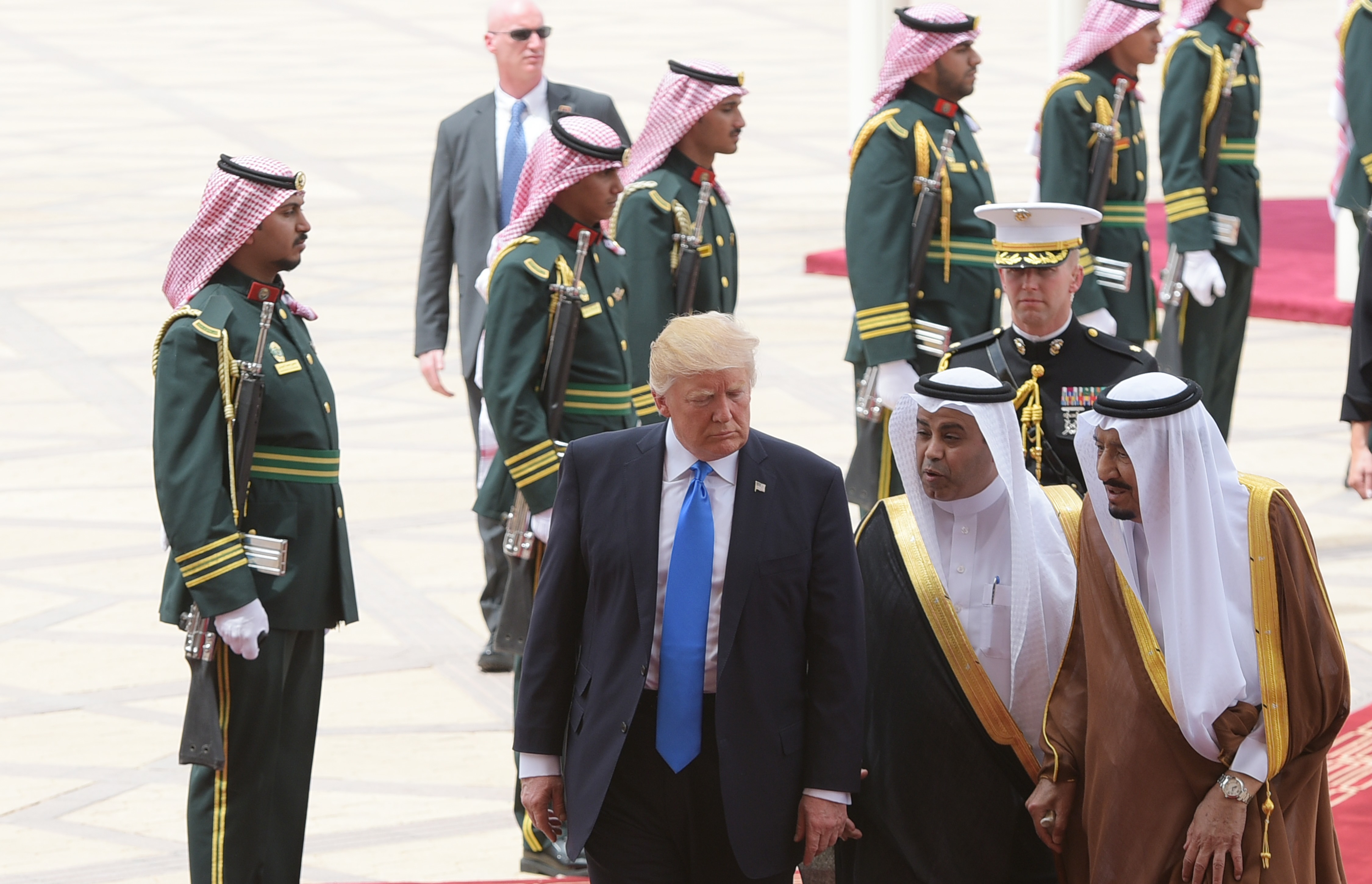 U.S. President Donald Trump walks with Saudi King Salman (right) during a trip in May.