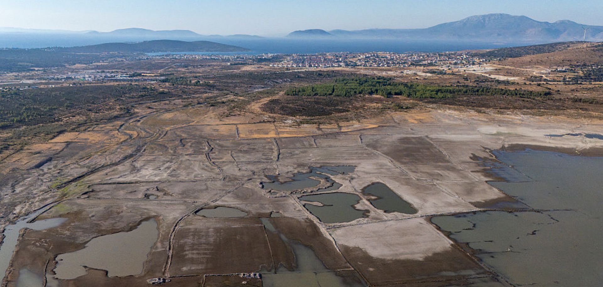 This aerial photograph shows dry areas near the Alacati Kutlu Aktas Dam in Izmir, Turkey, on July 30, 2025.