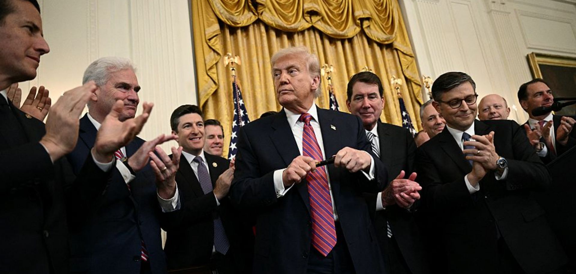 U.S. President Donald Trump prepares to sign the GENIUS Act in the East Room of the White House in Washington, DC, on July 18, 2025.