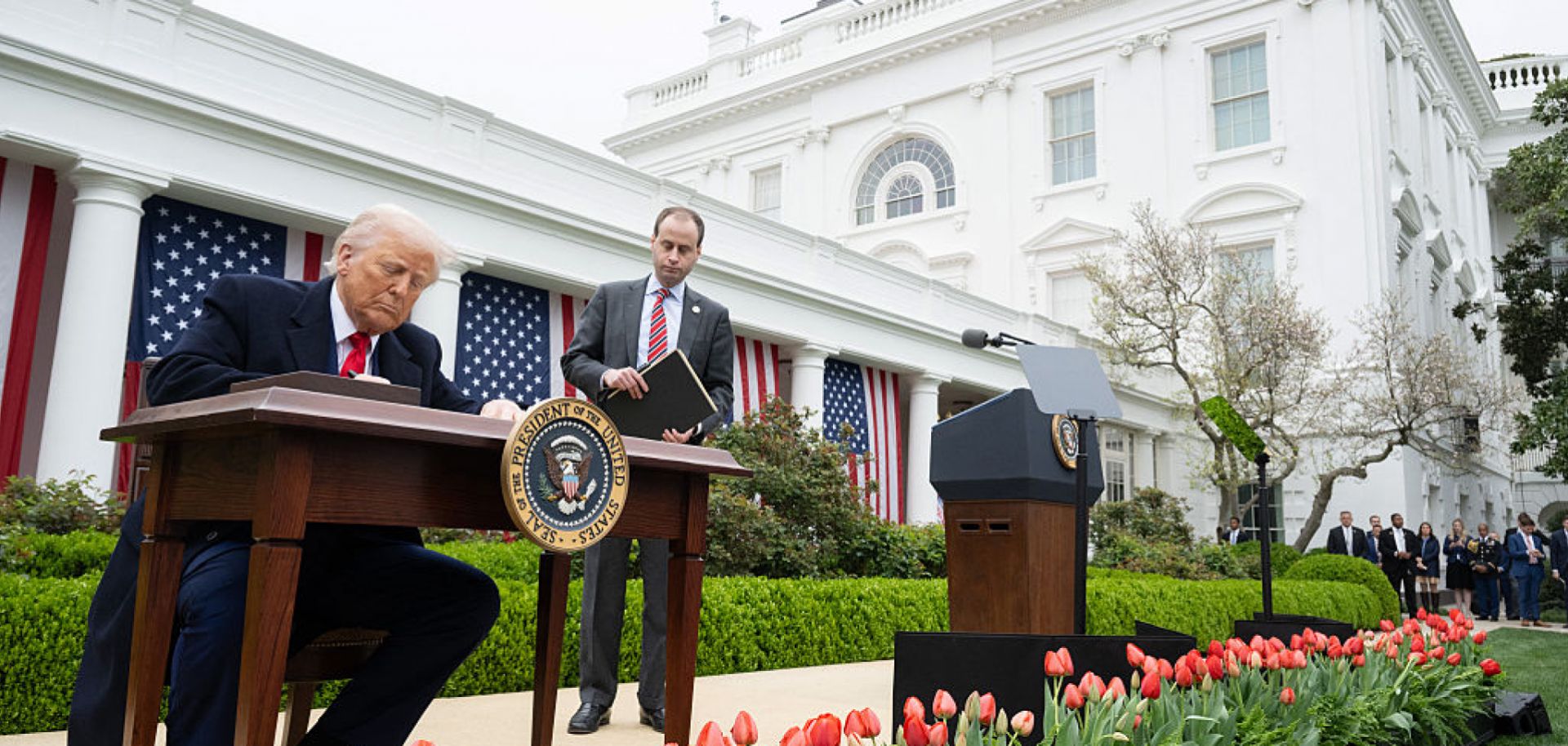 U.S. President Donald Trump signs an executive order after delivering remarks on reciprocal tariffs during an April 2 event in the Rose Garden in Washington.