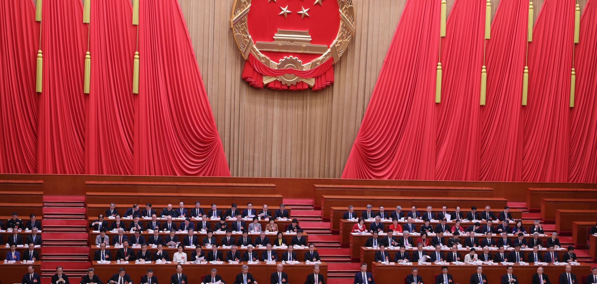Chinese President Xi Jinping (center) and Premier Li Qiang attend a plenary session of China's National People's Congress (NPC) at the Great Hall of the People on March 9, 2026, in Beijing, China.