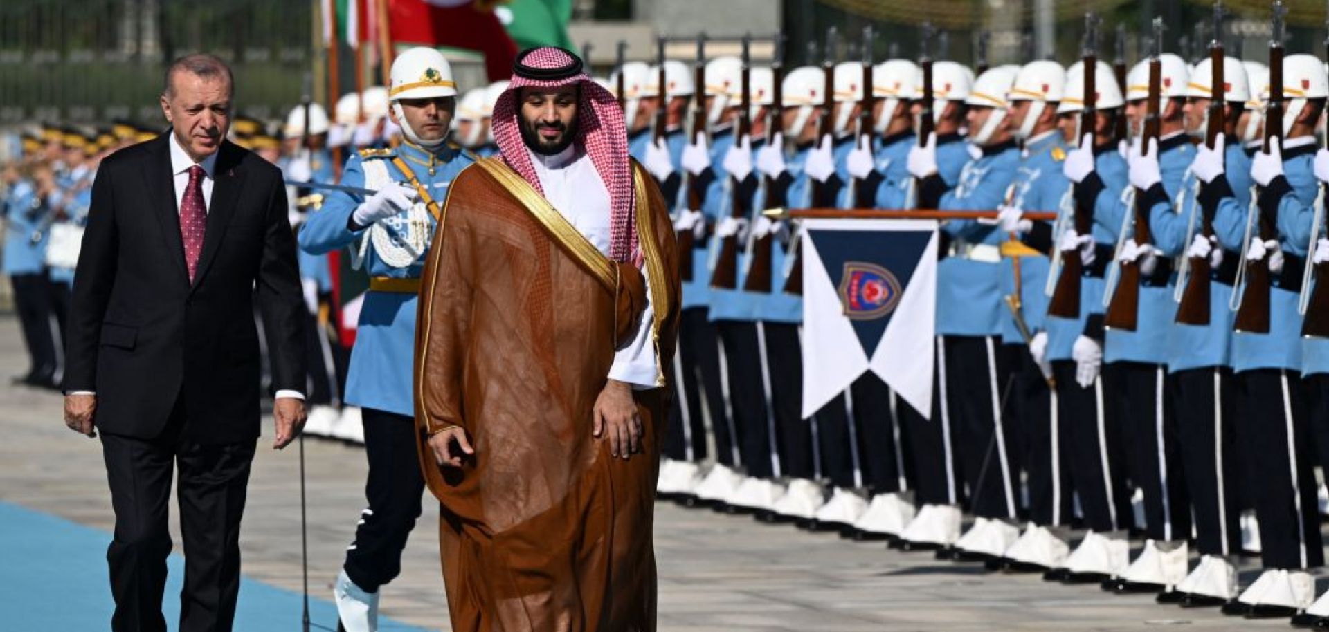 Turkish President Recep Tayyip Erdogan (L) and Saudi Crown Prince Mohammed bin Salman (R) inspect the honor guard during an official welcoming ceremony at the presidential complex in Ankara, Turkey, on June 22, 2022.