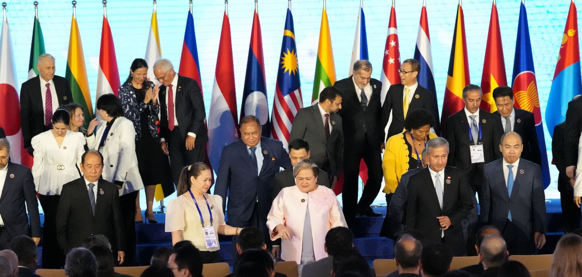Philippine Foreign Secretary Theresa Lazaro (center) and other leaders leave after a group photo session on the sidelines of the ASEAN Foreign Ministers' Meeting in Manila on July 24, 2026.