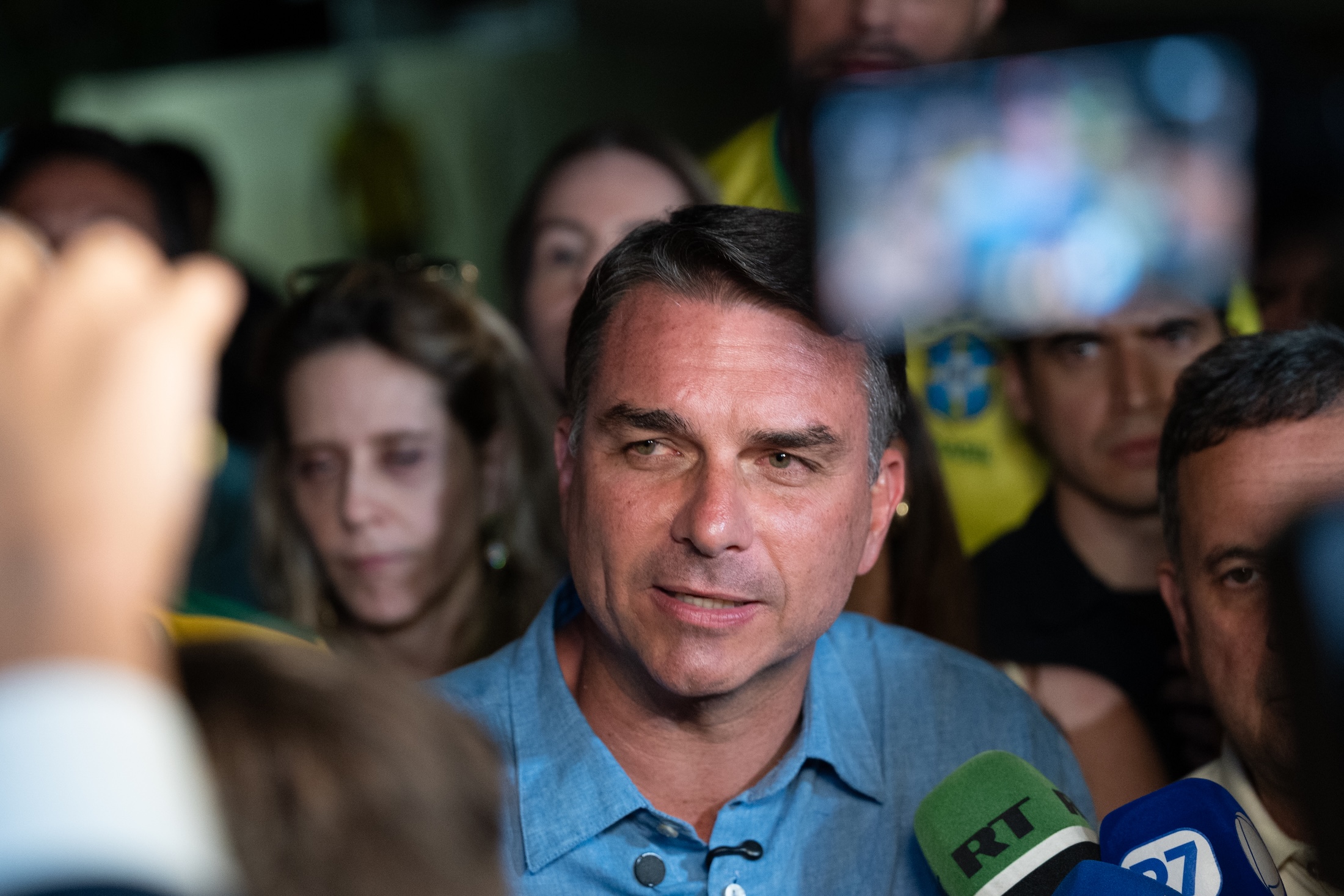 Flavio Bolsonaro speaks to the press as votes are tallied Oct. 4 in Brasilia.