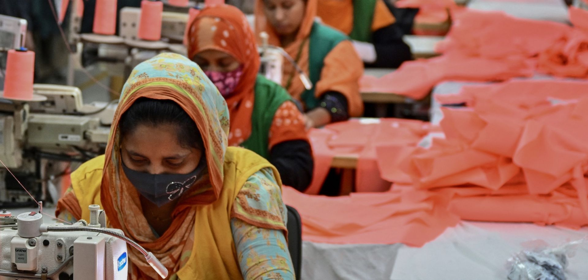 Garment workers sew clothes at a textile factory in Dhaka, Bangladesh, on Dec. 29, 2024.