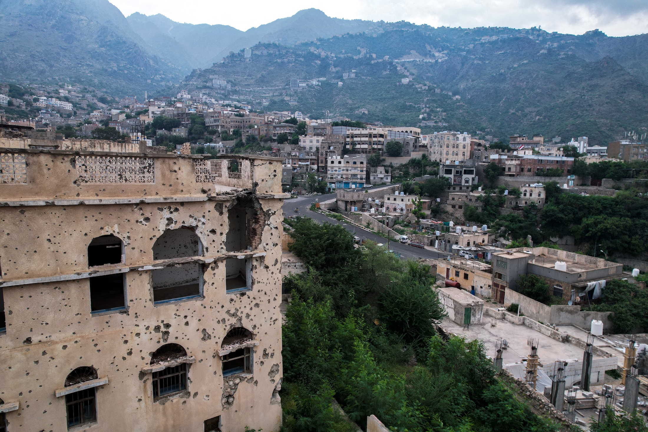 This aerial photograph taken by drone shows a shrapnel-riddled building in the city of Taiz, the capital of Yemen